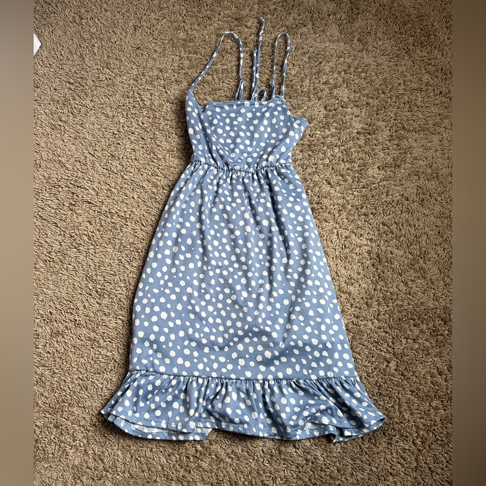 alterd state dress back has a little cut out blue with white dots